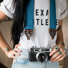 Blue vintage-style cotton canvas camera strap made by Original Fuzz in Nashville with a Yashica film camera.