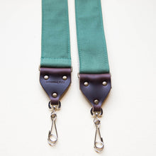 Green cotton canvas vintage-style camera strap with antique brass hardware by Original Fuzz.