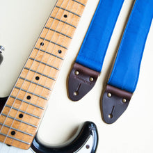 Blue vintage-style cotton canvas guitar strap made by Original Fuzz in Nashville with a Fender Jazzmaster.
