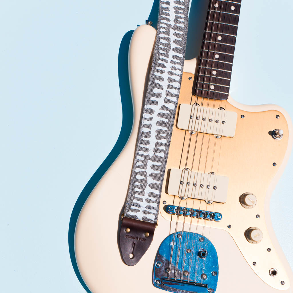 White and gray skeletal spine India block print vintage-style guitar strap by Original Fuzz.