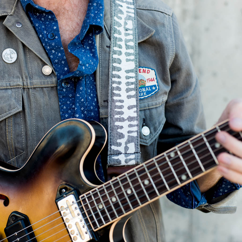 White and gray skeletal spine India block print vintage-style guitar strap by Original Fuzz.