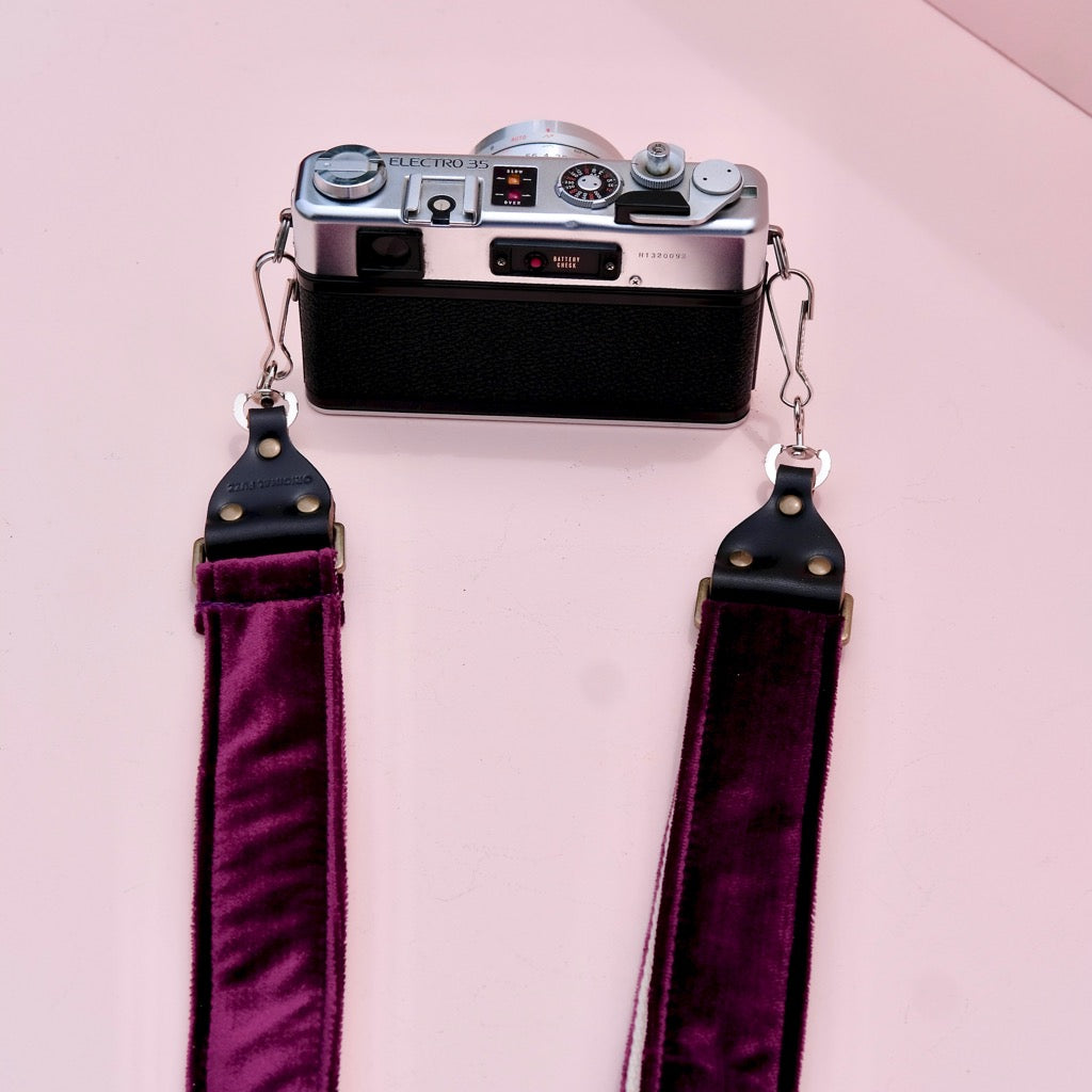 Original Fuzz purple velvet camera strap in the new skinny width with vintage camera.