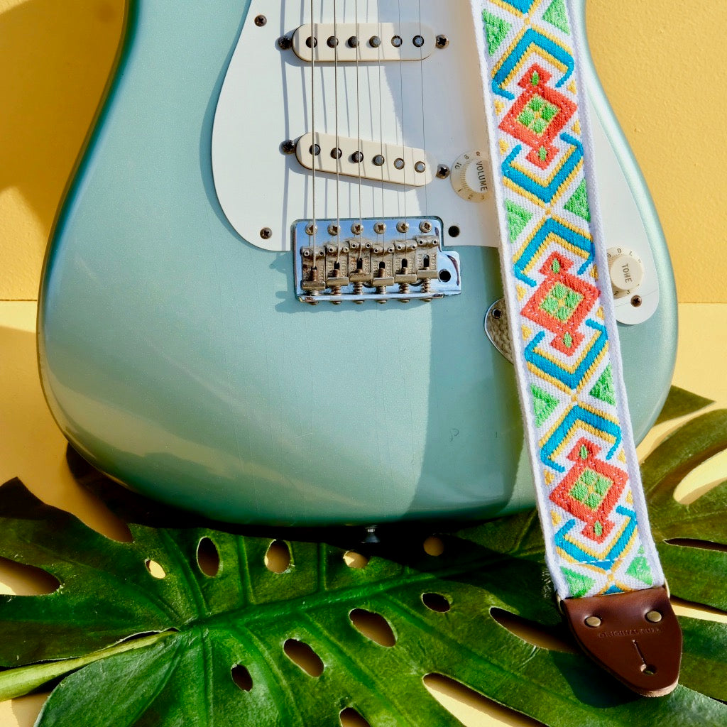 Original Fuzz summer sale 2019 featuring a vintage red, green and white guitar strap