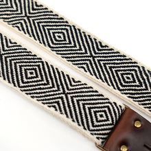 Closeup of handwoven black and white sacred diamonds on this handwoven Peruvian guitar strap