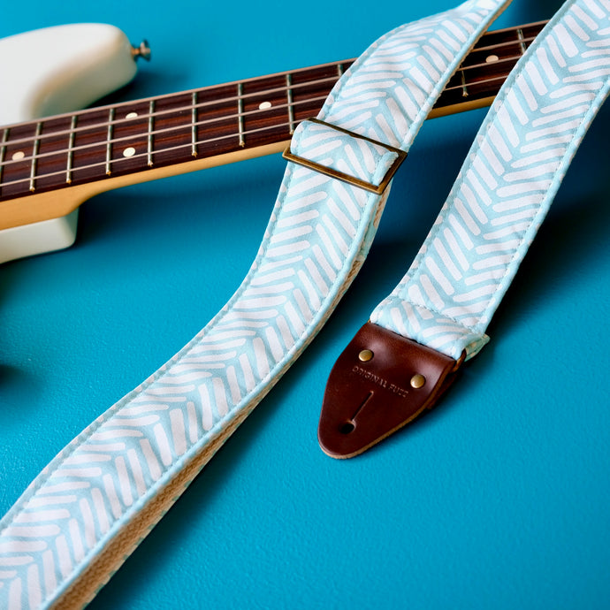 Light blue silkscreened guitar strap handmade in Nashville by Original Fuzz.