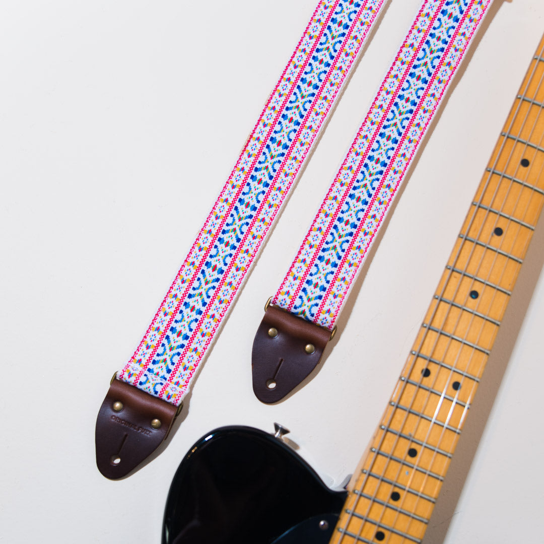 The vintage guitar strap in Hatch Blvd with a black Fender Telecaster from 1983