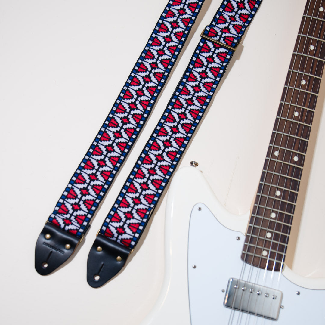 The vintage guitar strap in Patton Ave with a white Fender Jaguar