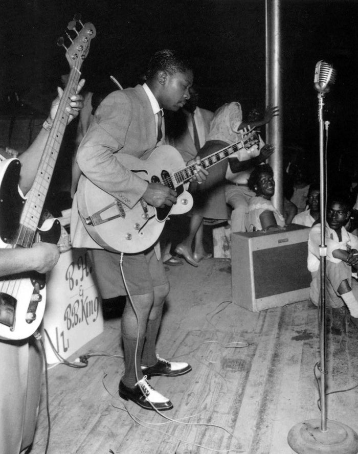 Early photo of B.B. King wearing shorts while he performs