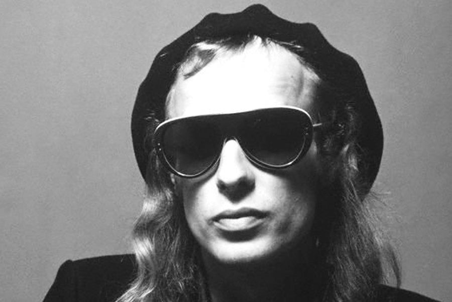 Brian Eno with sunglasses on in the 70s