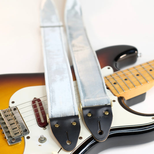 Wide view of guitar strap in pale silver blue velvet with black leather end-tabs. Made in Nashville by Original Fuzz.