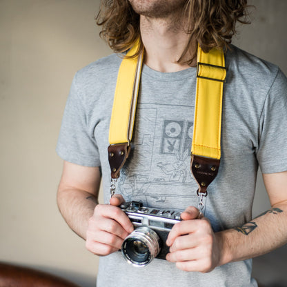 Yellow cotton canvas vintage-style camera strap with antique brass hardware made by Original Fuzz in Nashville, TN.