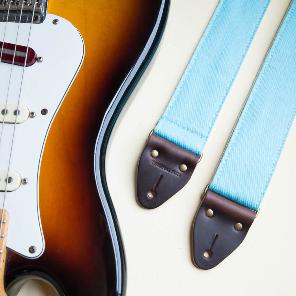 Light arctic blue cotton canvas vintage-style guitar strap made by Original Fuzz in Nashville, TN with a Fender Jazzmaster.