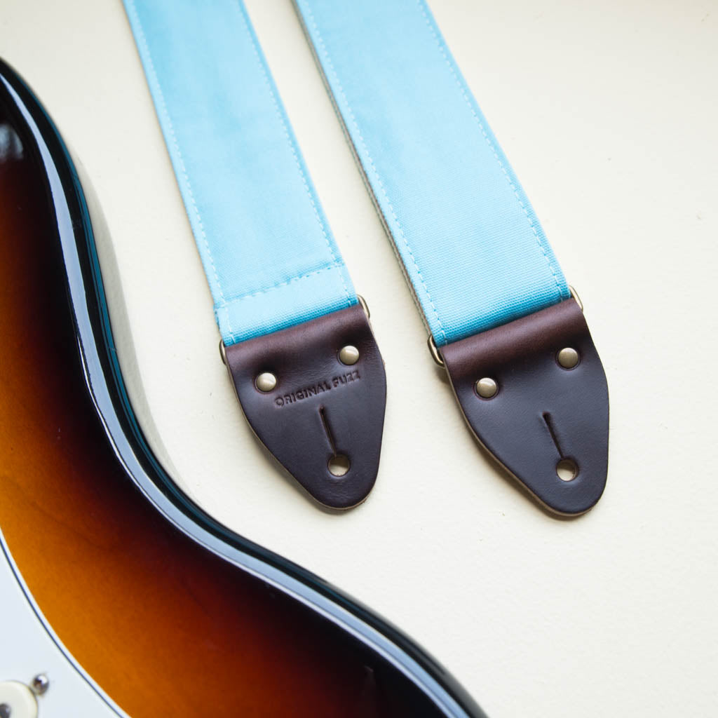 Light arctic blue cotton canvas vintage-style guitar strap made by Original Fuzz in Nashville, TN with a Fender Jazzmaster.