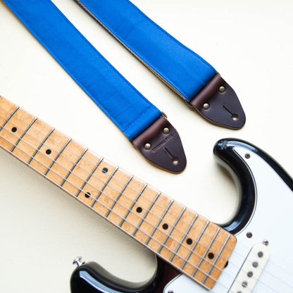 Blue vintage-style cotton canvas guitar strap made by Original Fuzz in Nashville with a Fender Jazzmaster.