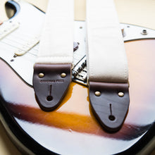 Cream white cotton canvas vintage-style guitar strap made by Original Fuzz in Nashville, TN with a Fender Jazzmaster.