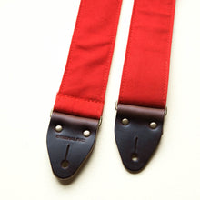 Red cotton canvas vintage-style guitar strap with antique brass hardware made by Original Fuzz in Nashville.
