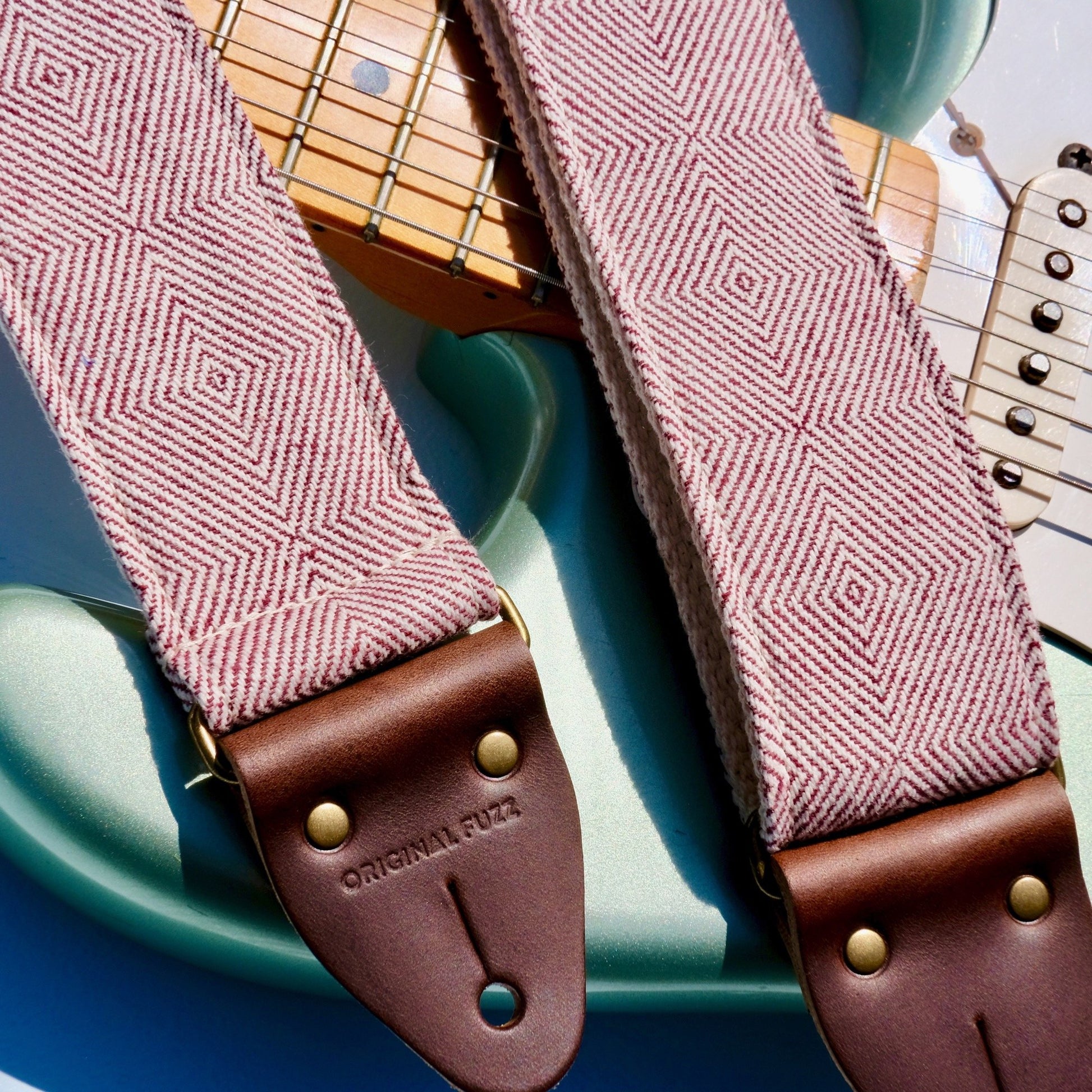 Red woven guitar strap made with fair-trade fabric from India by Original Fuzz in Nashville. 