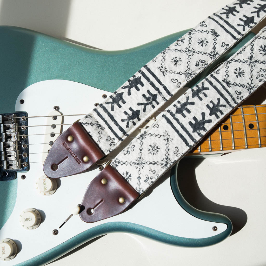 Vintage-style guitar strap made with black ink block-printed on white cotton fabric from India by Original Fuzz on Fender Stratocaster.