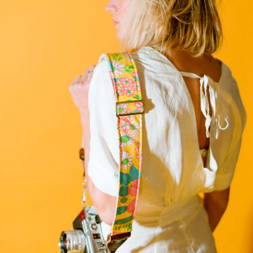 Original Fuzz vintage-style yellow floral camera strap.