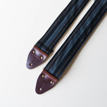 Vintage-style guitar strap made with reclaimed black striped cotton by Original Fuzz.