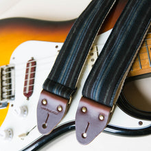 Vintage-style guitar strap made with reclaimed black striped cotton by Original Fuzz.
