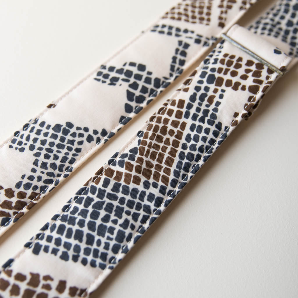 Vintage guitar strap made with repurposed 70s polyester with an abstract print by Original Fuzz.