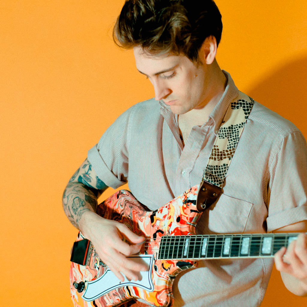 Vintage guitar strap made with repurposed 70s polyester with an abstract print by Original Fuzz.