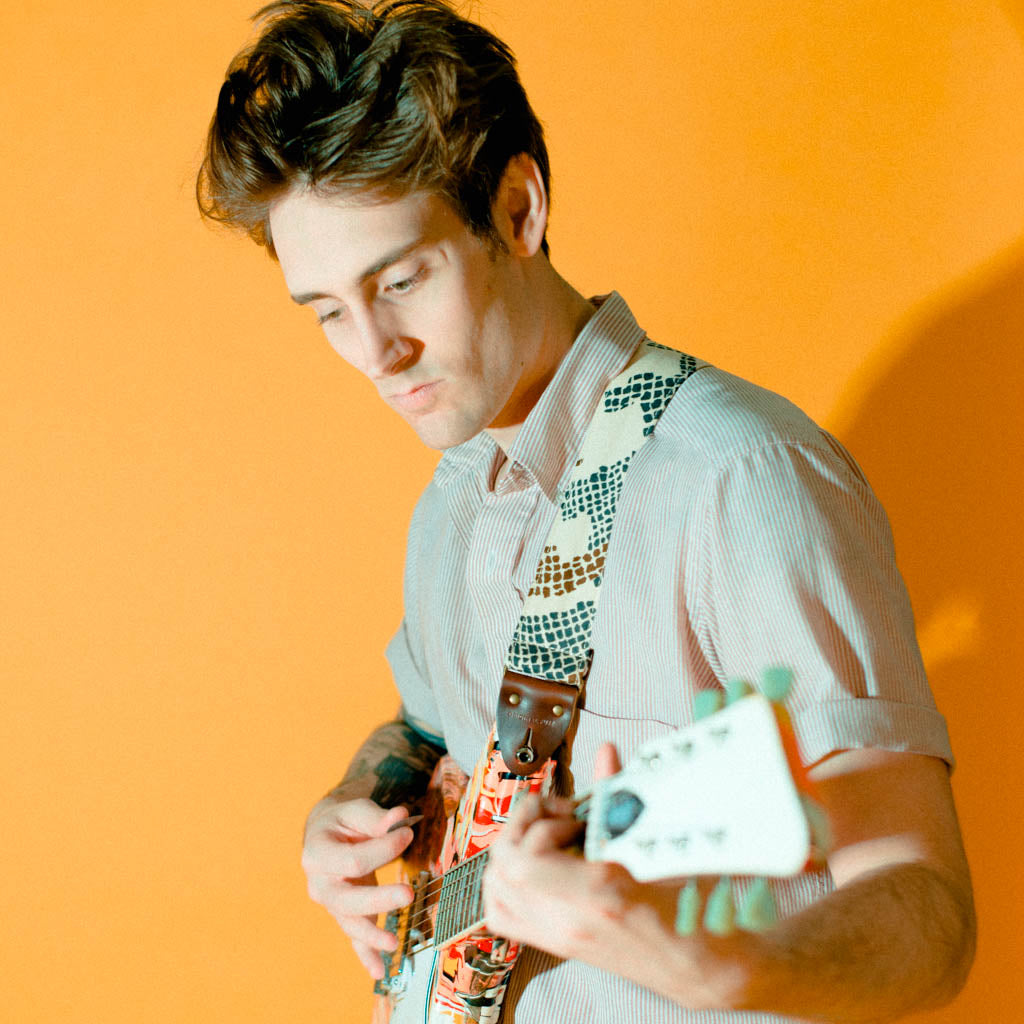 Vintage guitar strap made with repurposed 70s polyester with an abstract print by Original Fuzz.