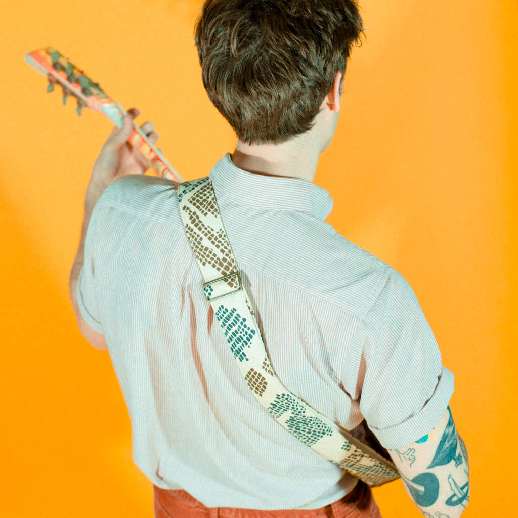 Vintage guitar strap made with repurposed 70s polyester with an abstract print by Original Fuzz.