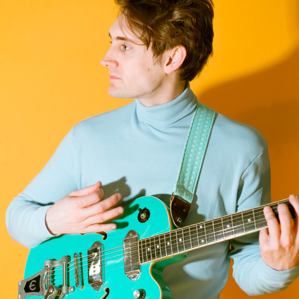 Vintage-style guitar strap made with repurposed surf green polyester with a diamond pattern by Original Fuzz.
