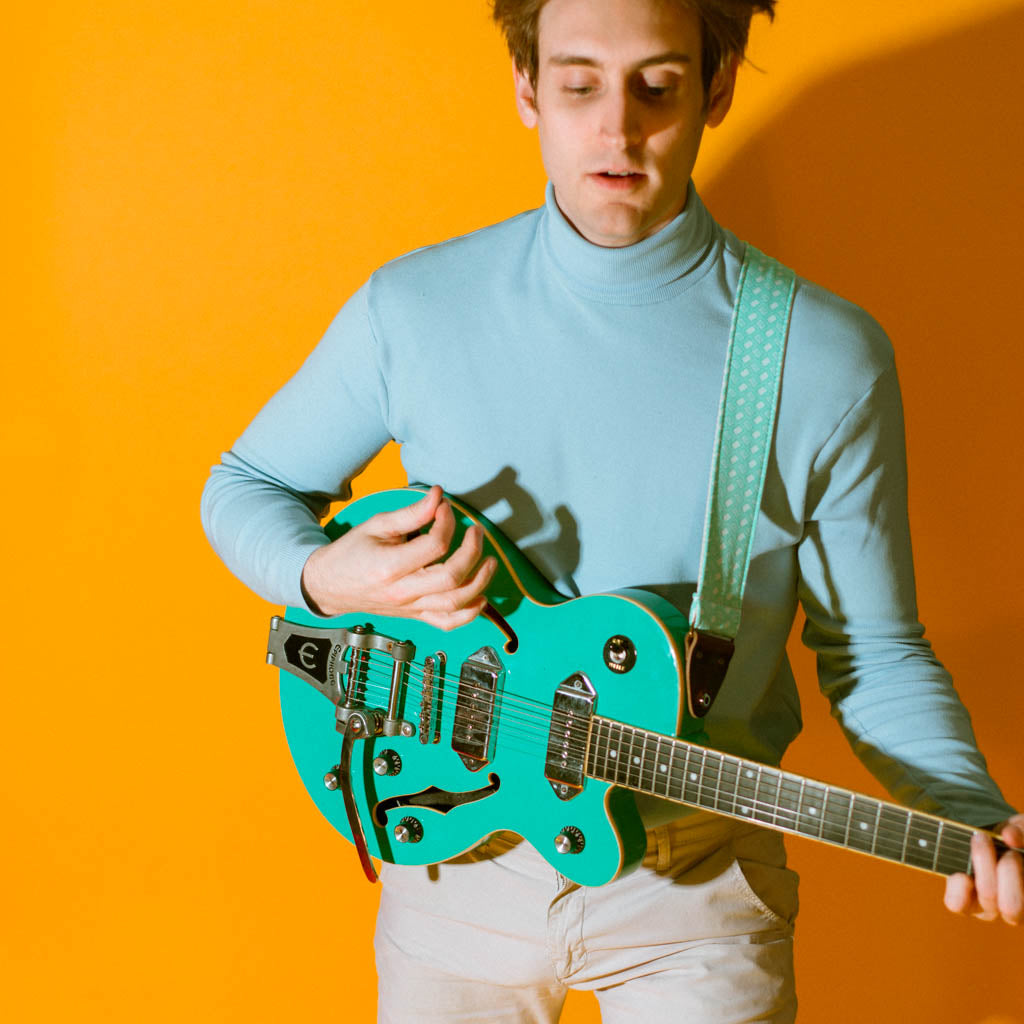 Vintage-style guitar strap made with repurposed surf green polyester with a diamond pattern by Original Fuzz.
