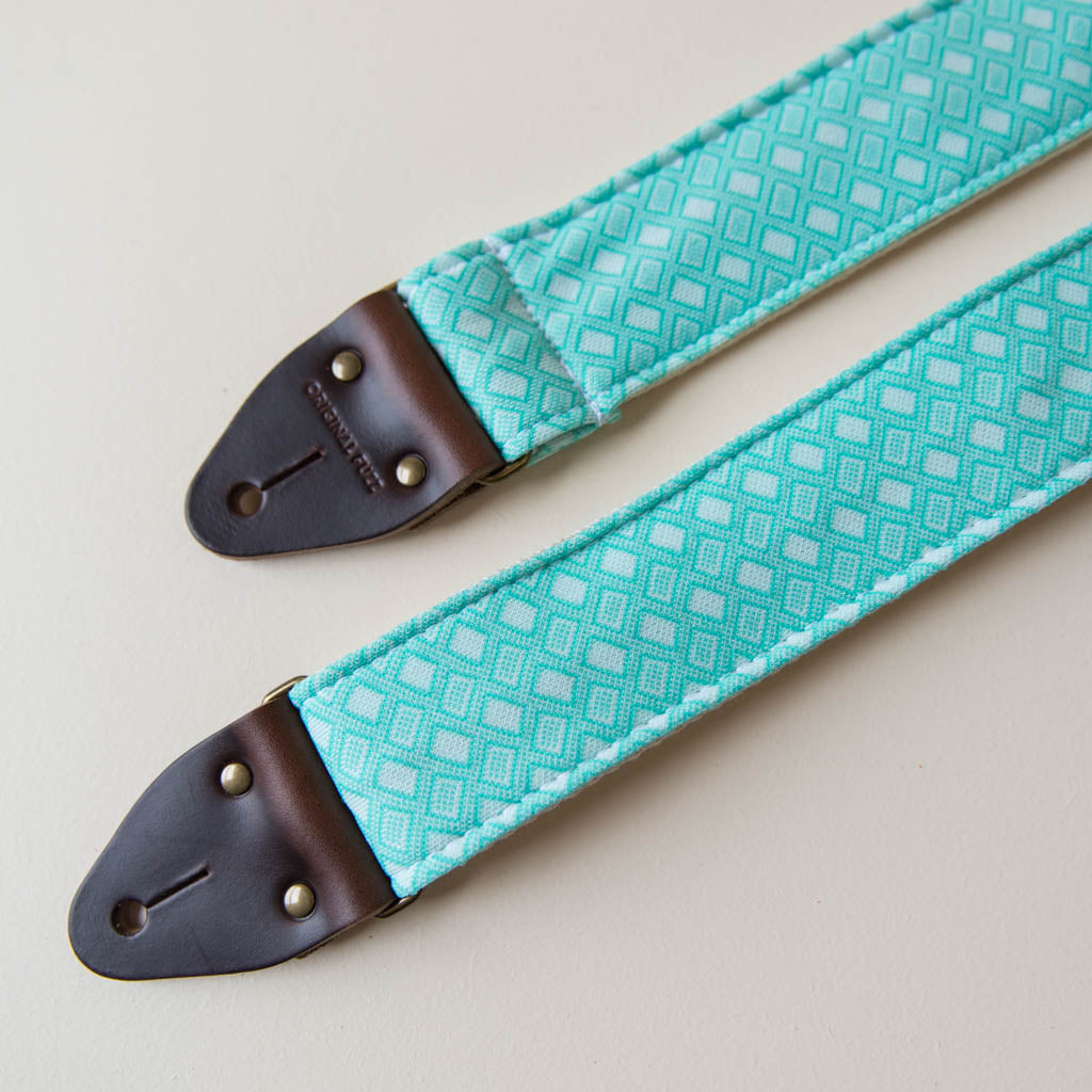 Vintage-style guitar strap made with repurposed surf green polyester with a diamond pattern by Original Fuzz.