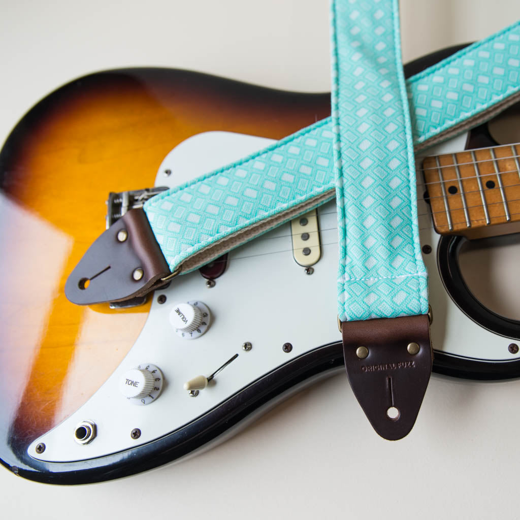 Vintage-style guitar strap made with repurposed surf green polyester with a diamond pattern by Original Fuzz.