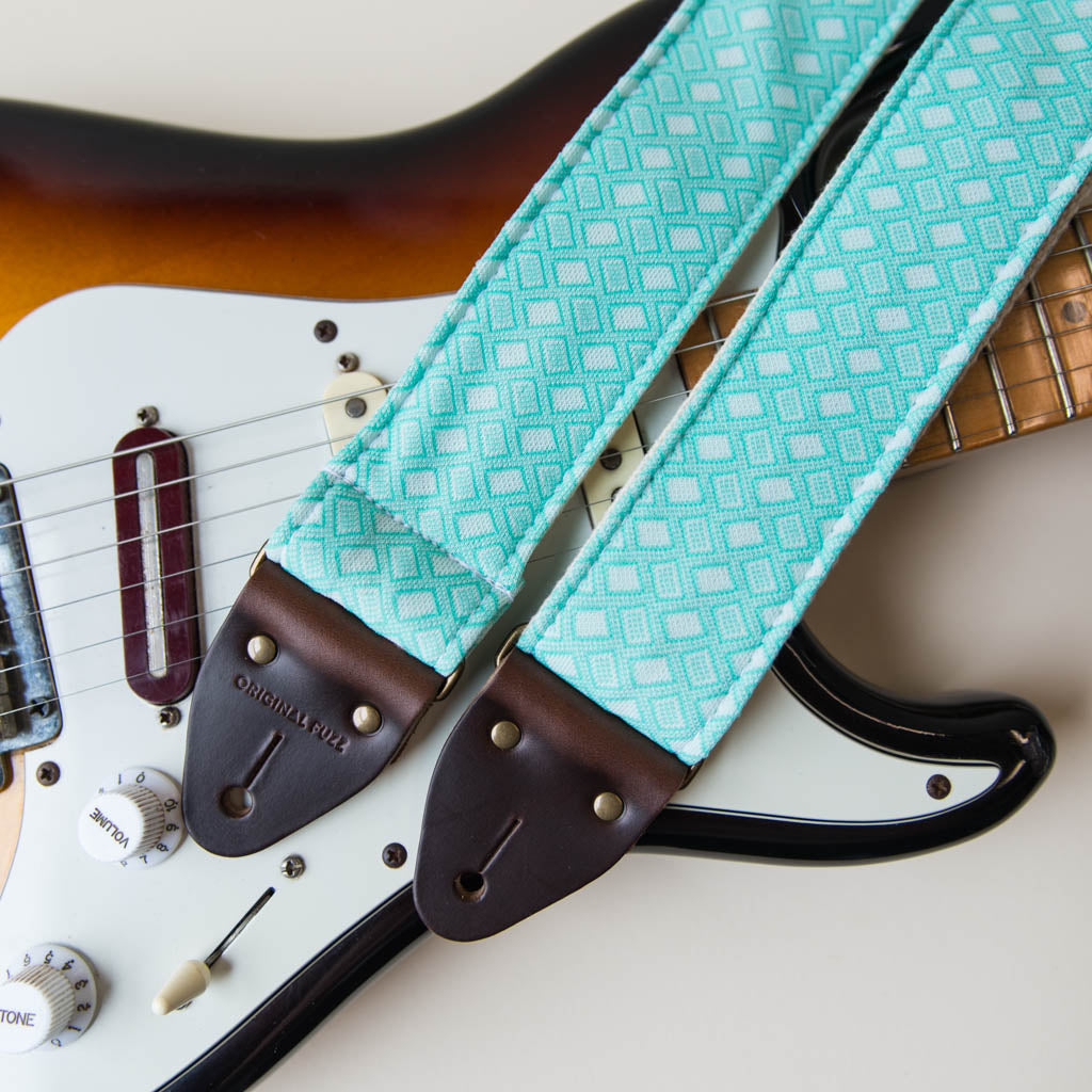 Vintage-style guitar strap made with repurposed surf green polyester with a diamond pattern by Original Fuzz.