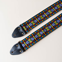 Vintage-style guitar strap made with a 60s style colorful woven jacquard by Original Fuzz.