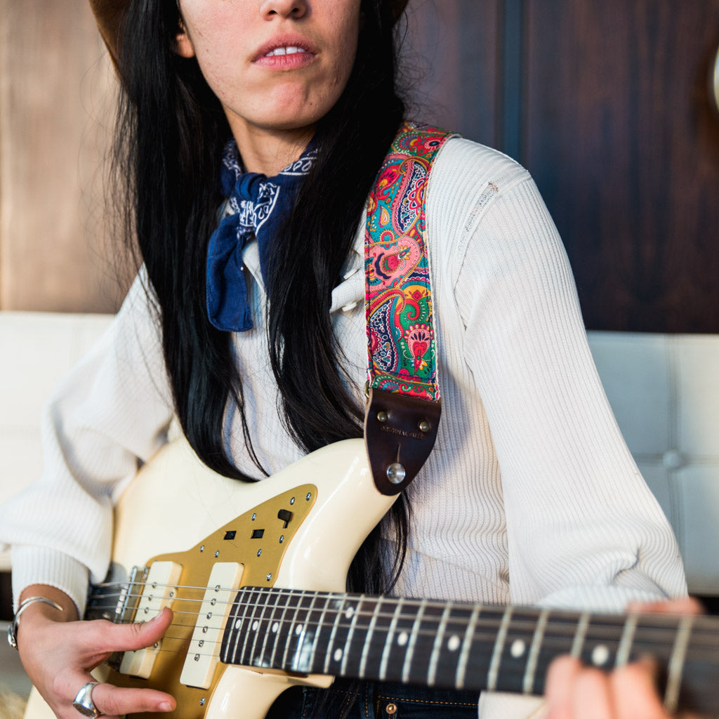 pink paisley guitar strap from the Nashville collection by Original Fuzz on model