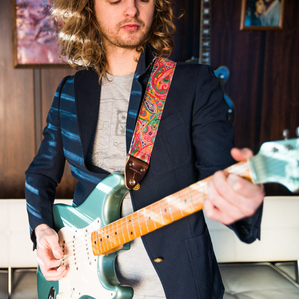 pink paisley guitar strap from the Nashville collection by Original Fuzz on model