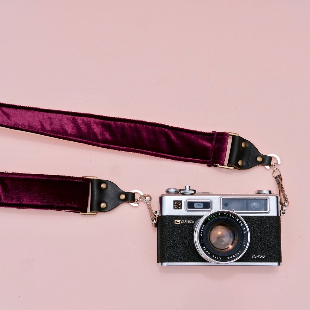 Original Fuzz purple velvet camera strap in the new skinny width with vintage camera.