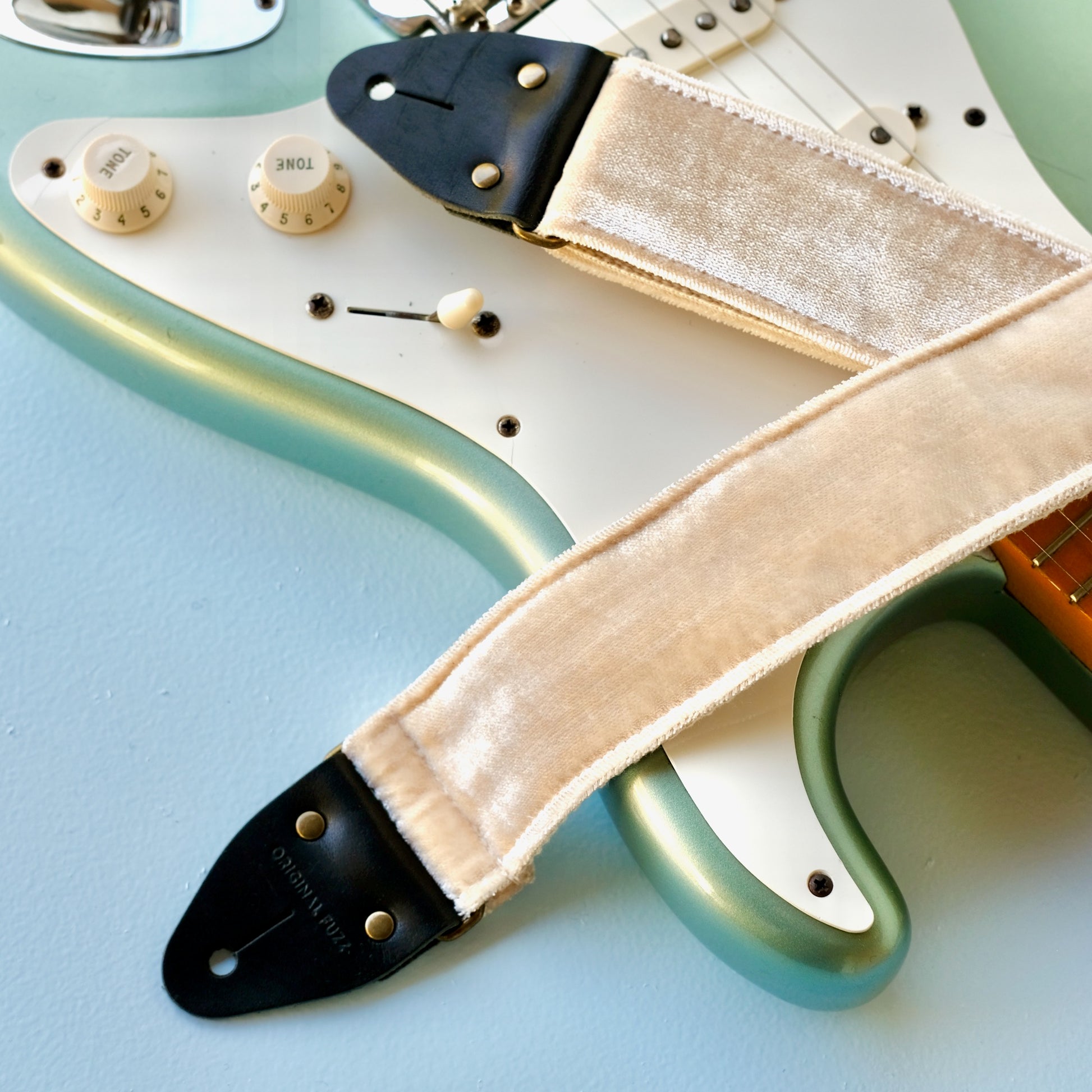 Cream velvet vintage-style guitar strap made in Nashville by Original Fuzz.