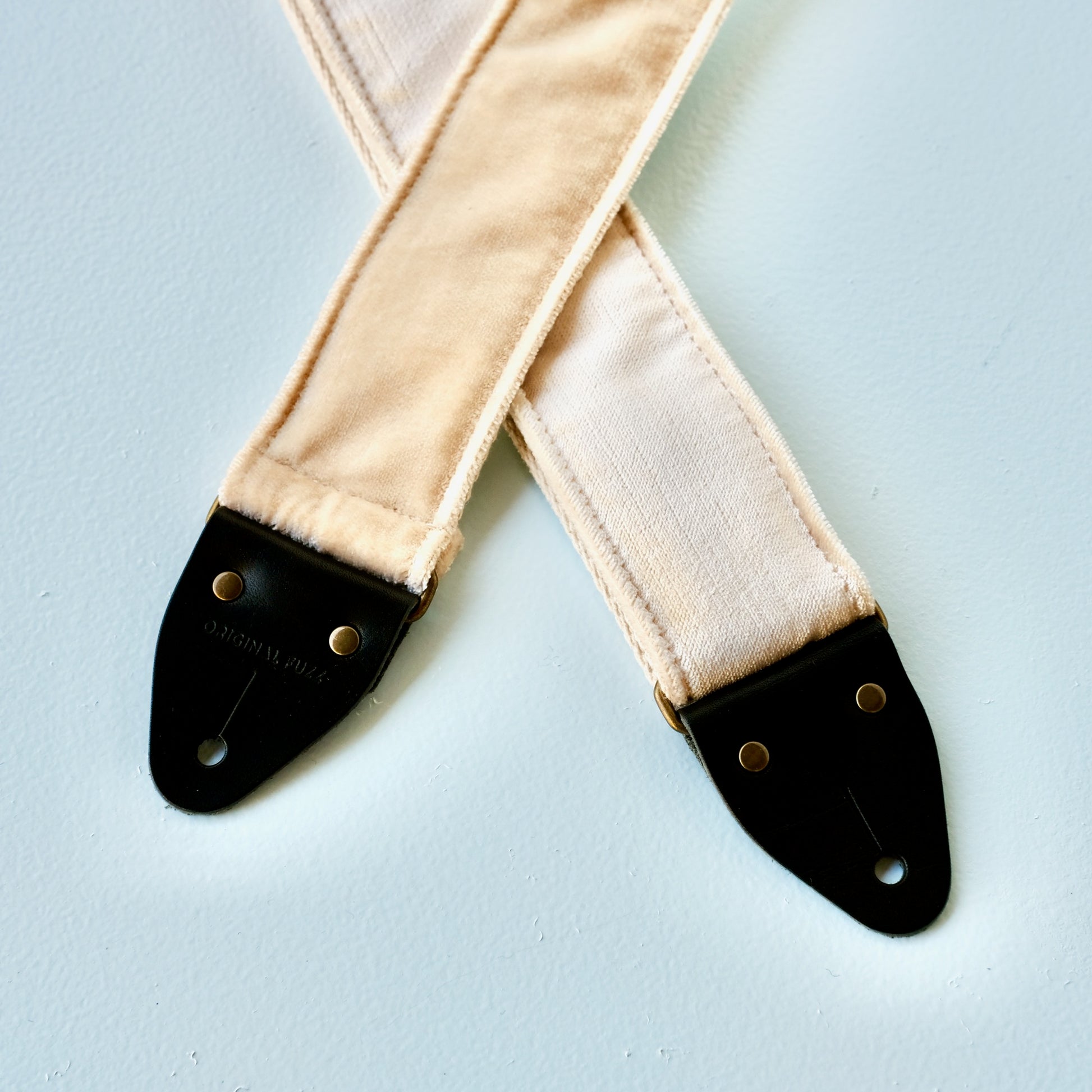 Cream velvet vintage-style guitar strap made in Nashville by Original Fuzz.