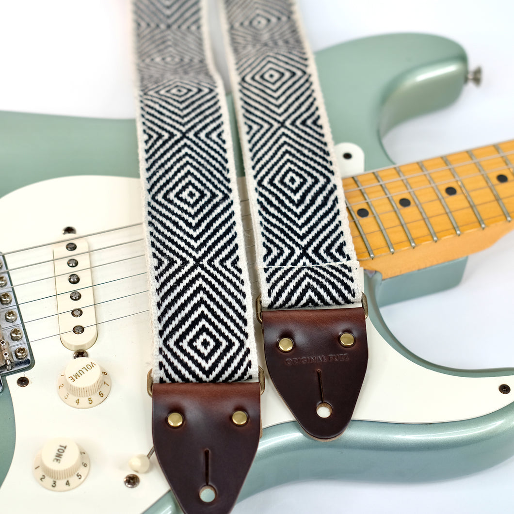 Featured photo for Peruvian guitar strap in handwoven black and white diamonds with fender Stratocaster