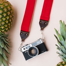 Red cotton canvas vintage-style camera strap made by Original Fuzz in Nashville with a Yashica film camera.