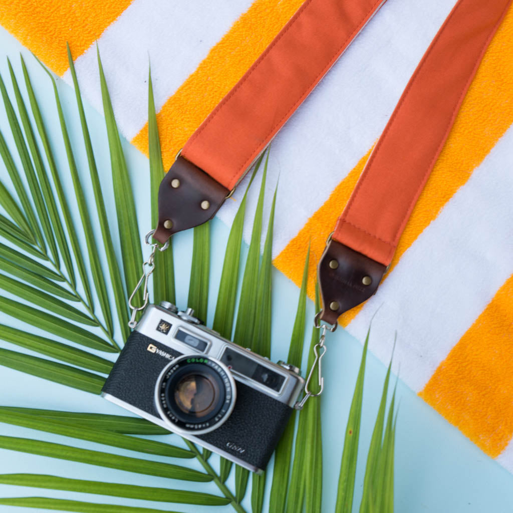 Orange cotton canvas vintage-style camera strap made by Original Fuzz with Yashica film camera.