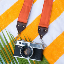 Orange cotton canvas vintage-style camera strap made by Original Fuzz with Yashica film camera.