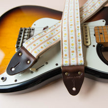Vintage guitar strap with a yellow ditsy floral pattern by Original Fuzz.