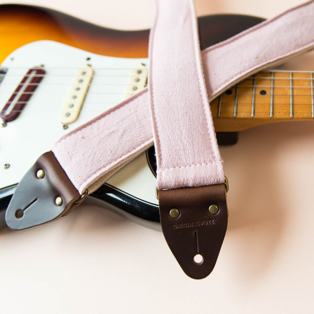 Light pink silk vintage guitar strap made by Original Fuzz. 