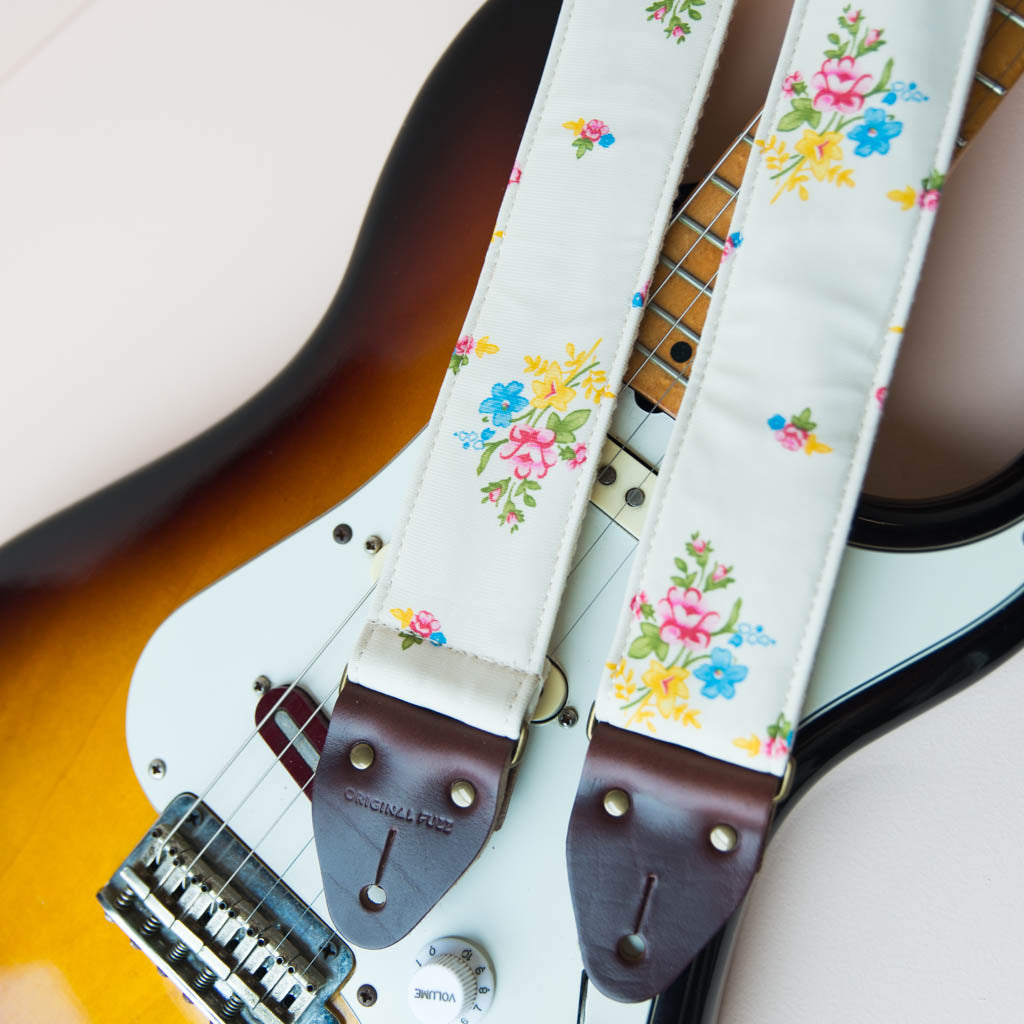 Reclaimed vintage guitar strap in 70s cream polyester with floral design made by Original Fuzz.