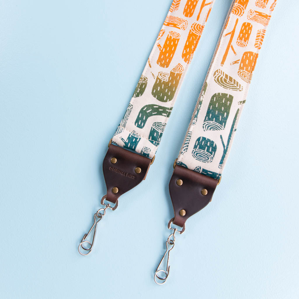 tree stumps silkscreen vintage style camera strap by original fuzz and grand palace