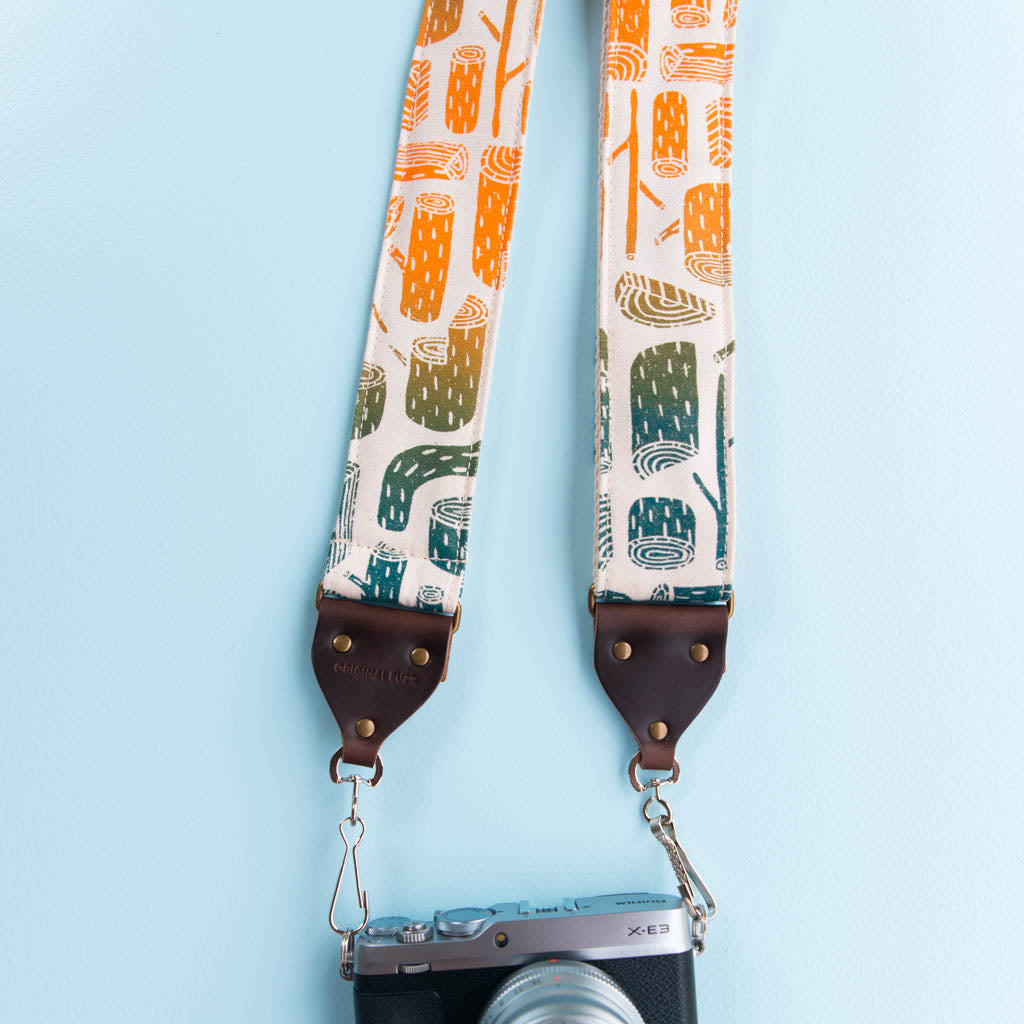 tree stumps silkscreen vintage style camera strap by original fuzz and grand palace