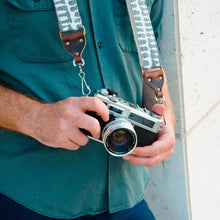 White and gray vintage-style skinny camera strap made with fabric block printed in India by Original Fuzz in Nashville, TN. 